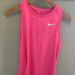 Pink Nike running shirt.